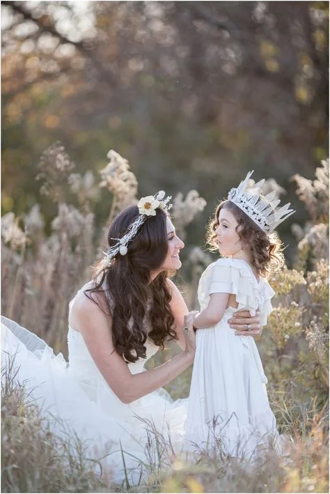Creative mother daughter photoshoot ideas wearing a crown