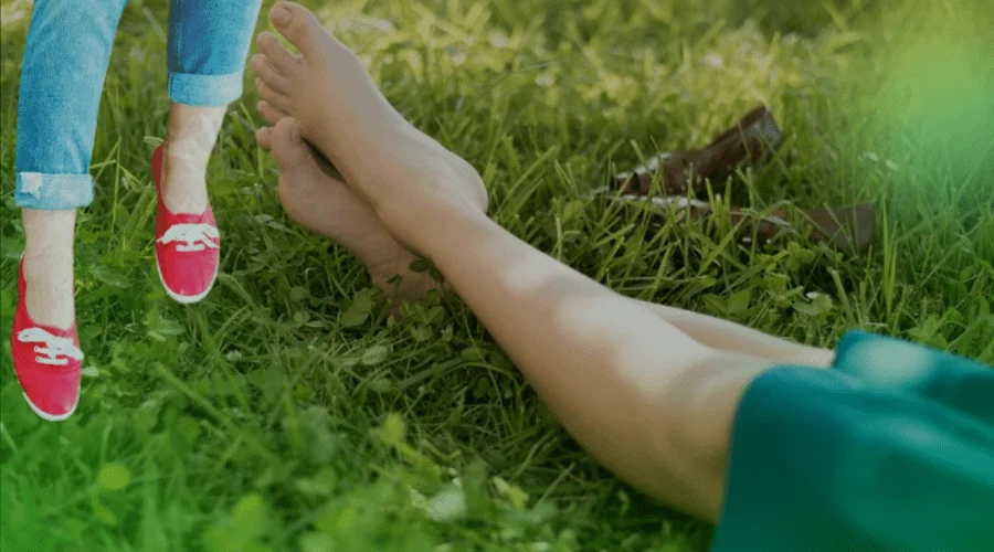 Feet on a Lush Green Lawn