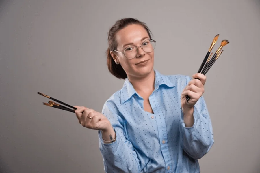 Artist In the Studio Holding a Paintbrush, Professional Headshot Examples