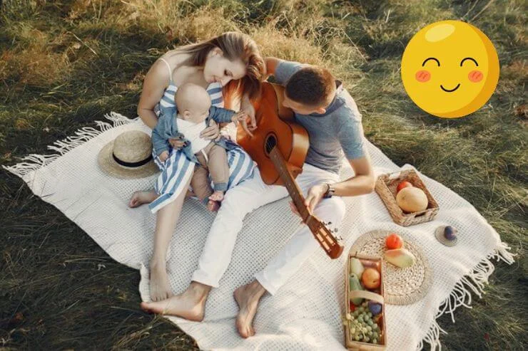 Family dressed in light, coordinated summer outfits for an outdoor photoshoot featuring breathable fabrics, soft colors, and a bright seasonal setting.
